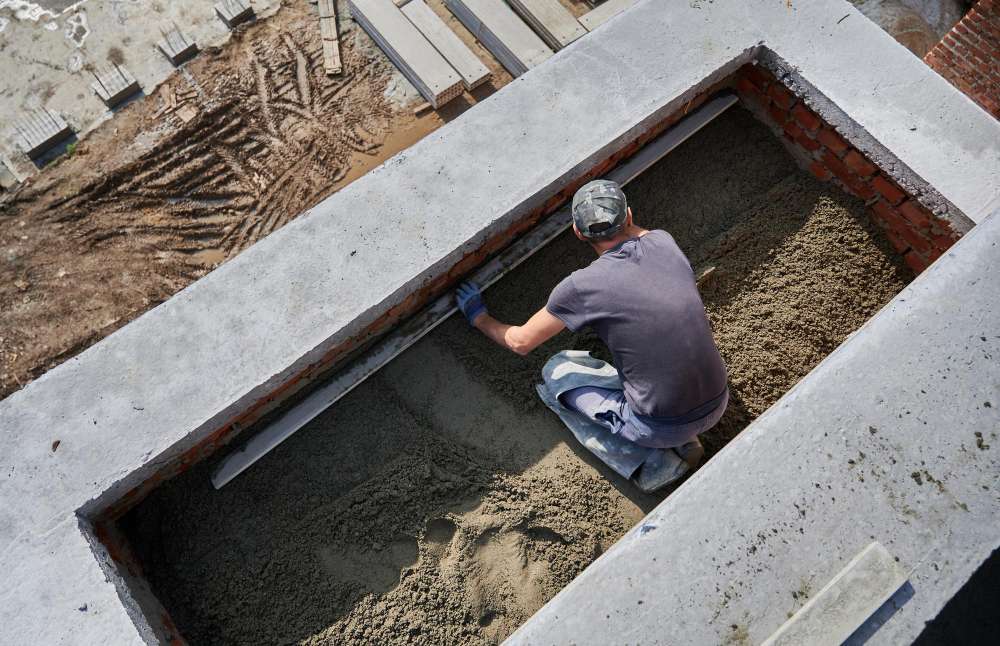 male worker screeding floor construction site 1